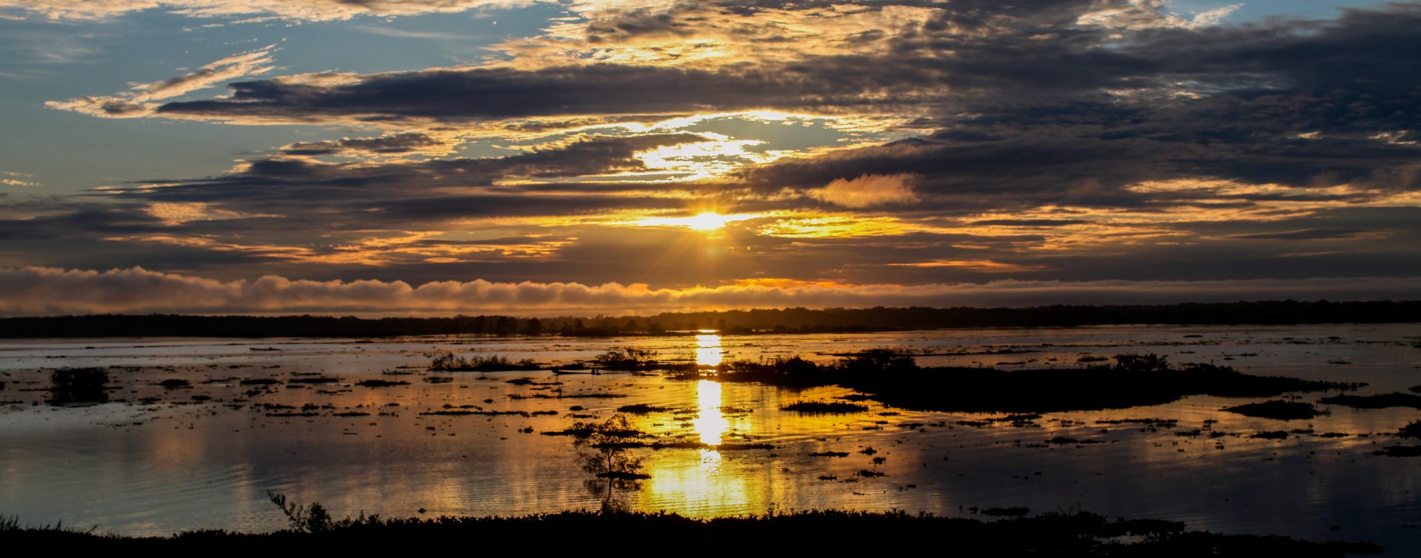 Sunrise on the Amazon. Near Iquitos, Peru. Photo credit: Yoho Media.