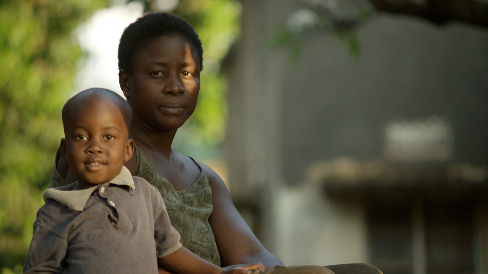 Portrait of a mother and child, early morning in Tororo, Uganda.