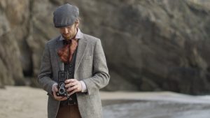 An actor playing the part of a photographer from the 1950s for a film about the history of the Blasket Islands.