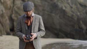 An actor playing the part of a photographer from the 1950s for a film about the history of the Blasket Islands.