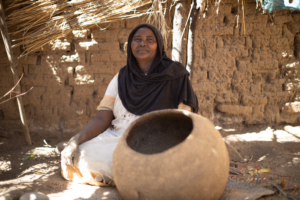 A potter making a traditional water jug, Kas, South Darfur.