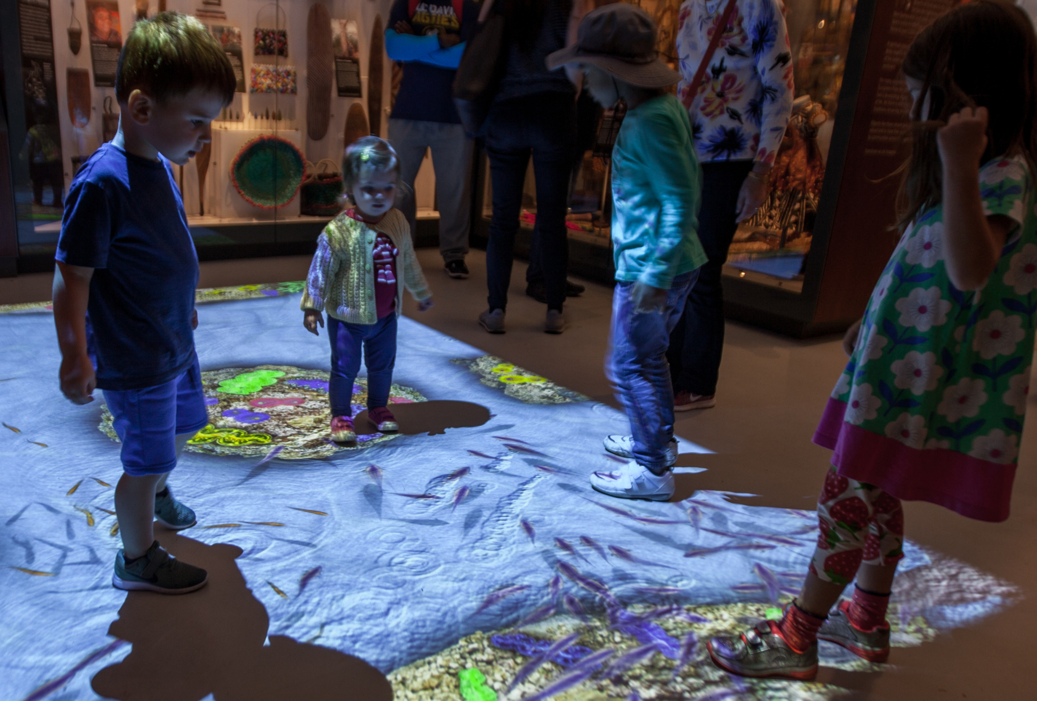 Children interacting with a Ocean floor projection